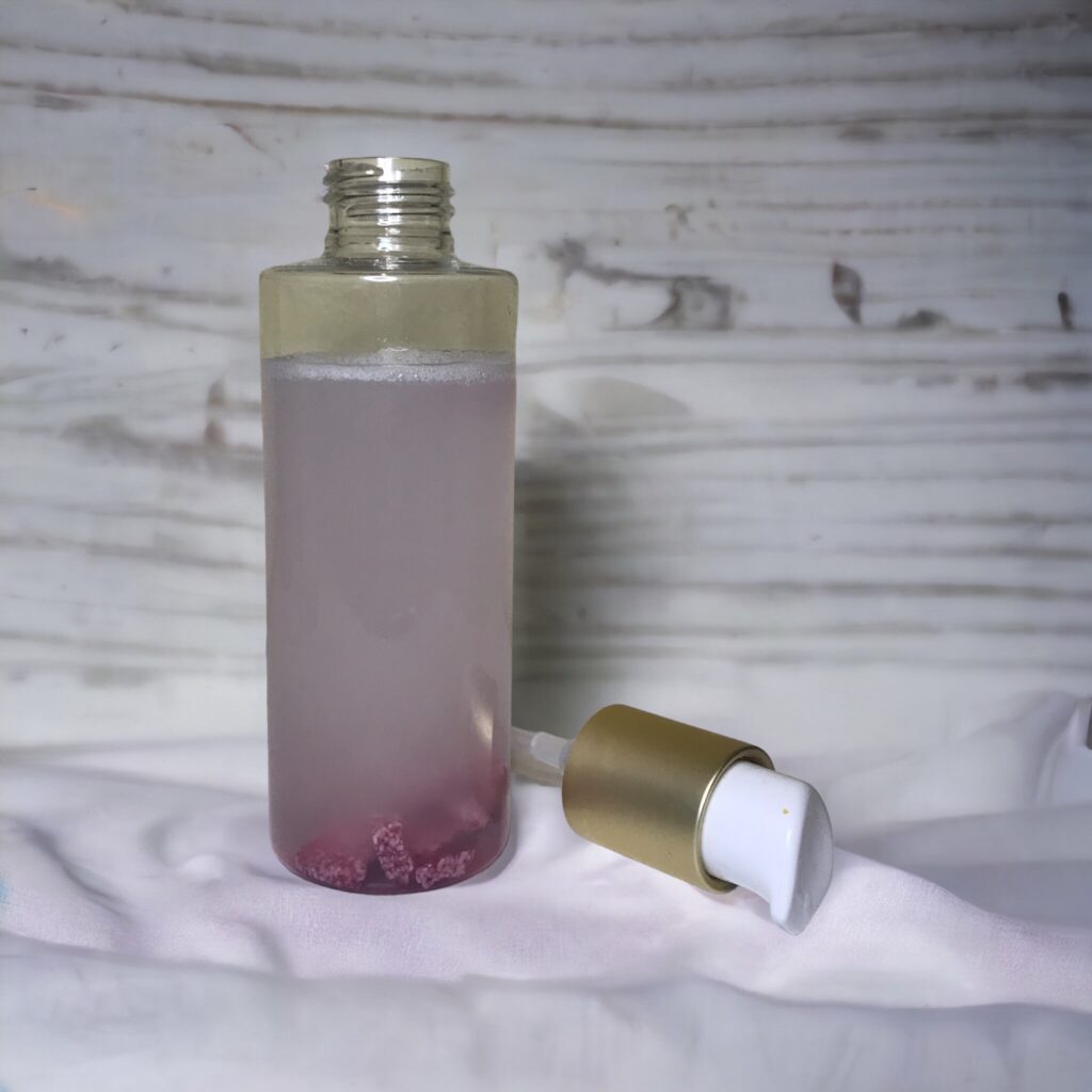 Shampoo bar pieces mixed with water in a reusable container.